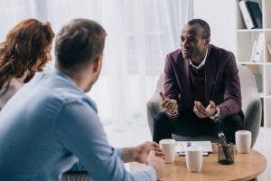 A counselor speaking to a couple