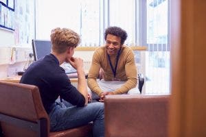 A counselor meets with a student.