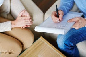 Human services worker with client