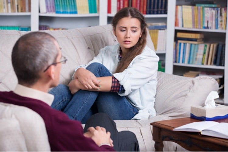 A counselor meets with a client.