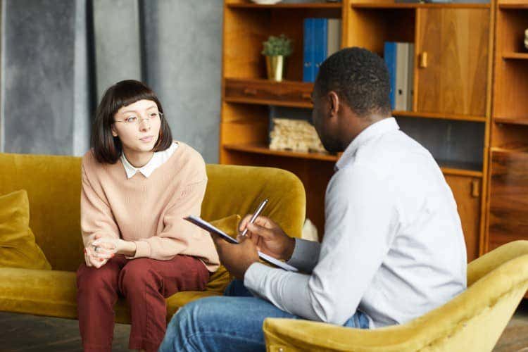 A counselor meets with a client.