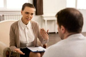Mental health counselor talks with a client