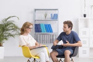 Young man speaking to a counselor