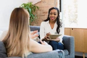 A counselor meets with a patient.